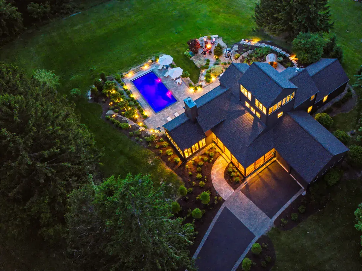The house, pool and grounds from above at night