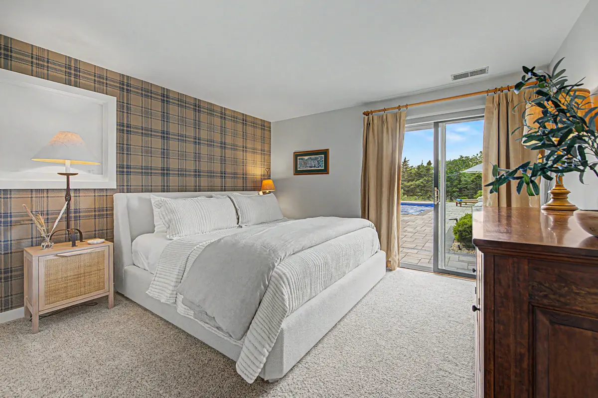Poolside king bedroom with a sliding door to the terrace