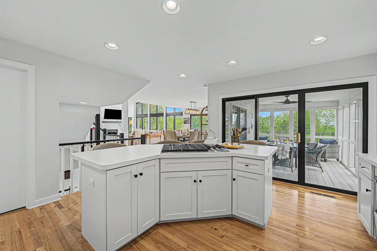 Kitchen opening to the four-season room