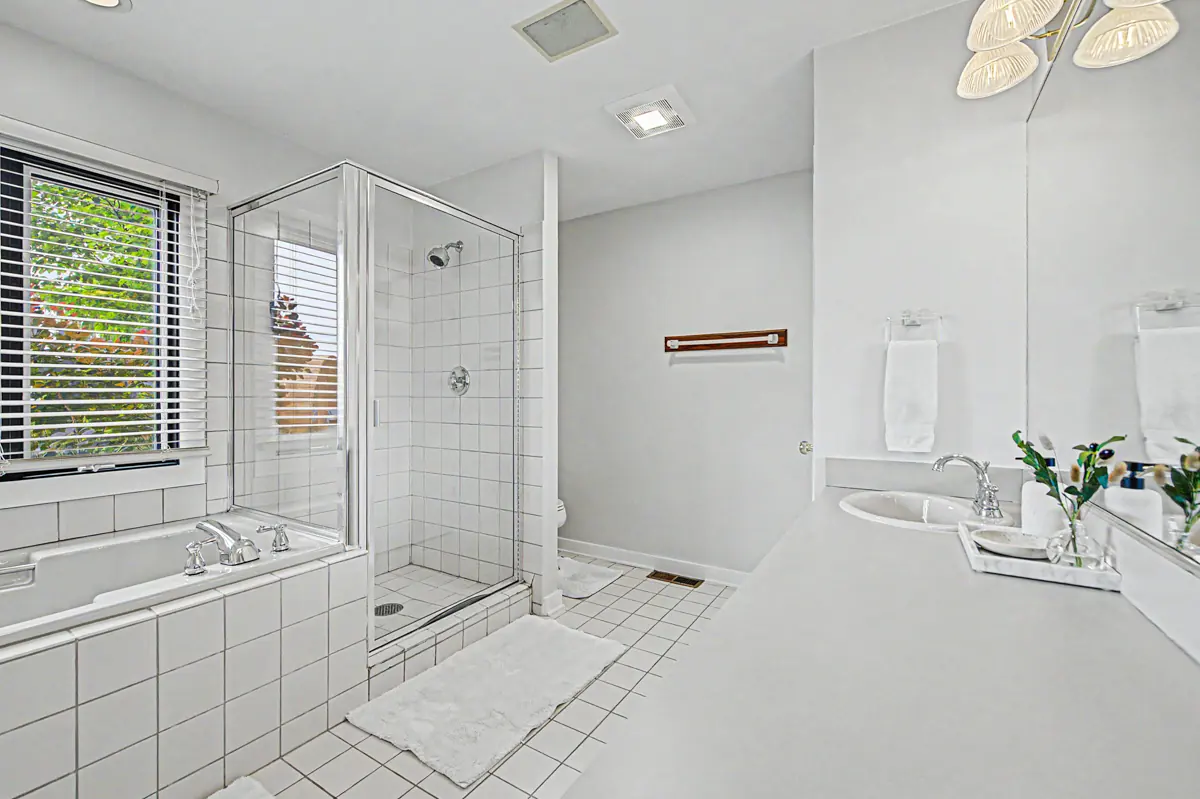 Primary bath with soaking tub and glass shower