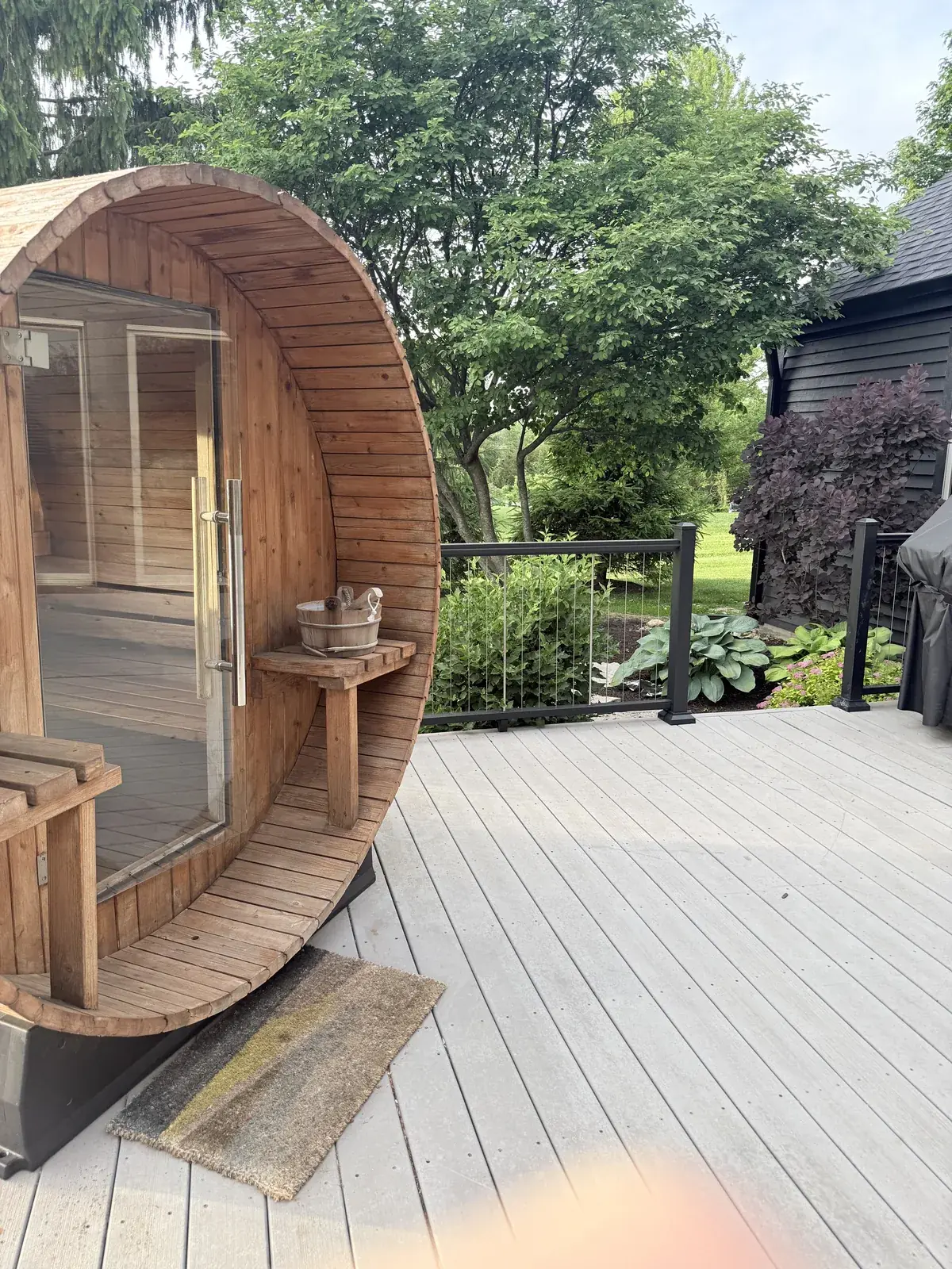 Cedar barrel sauna in summer